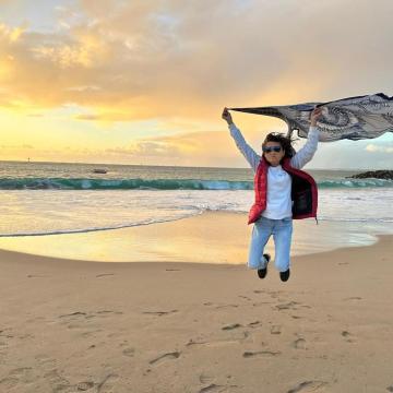 Cary Chang celebrating on the beach